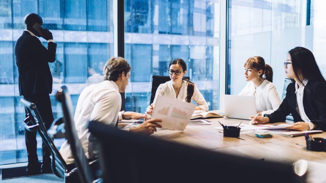 Co-workers sitting at a conference table