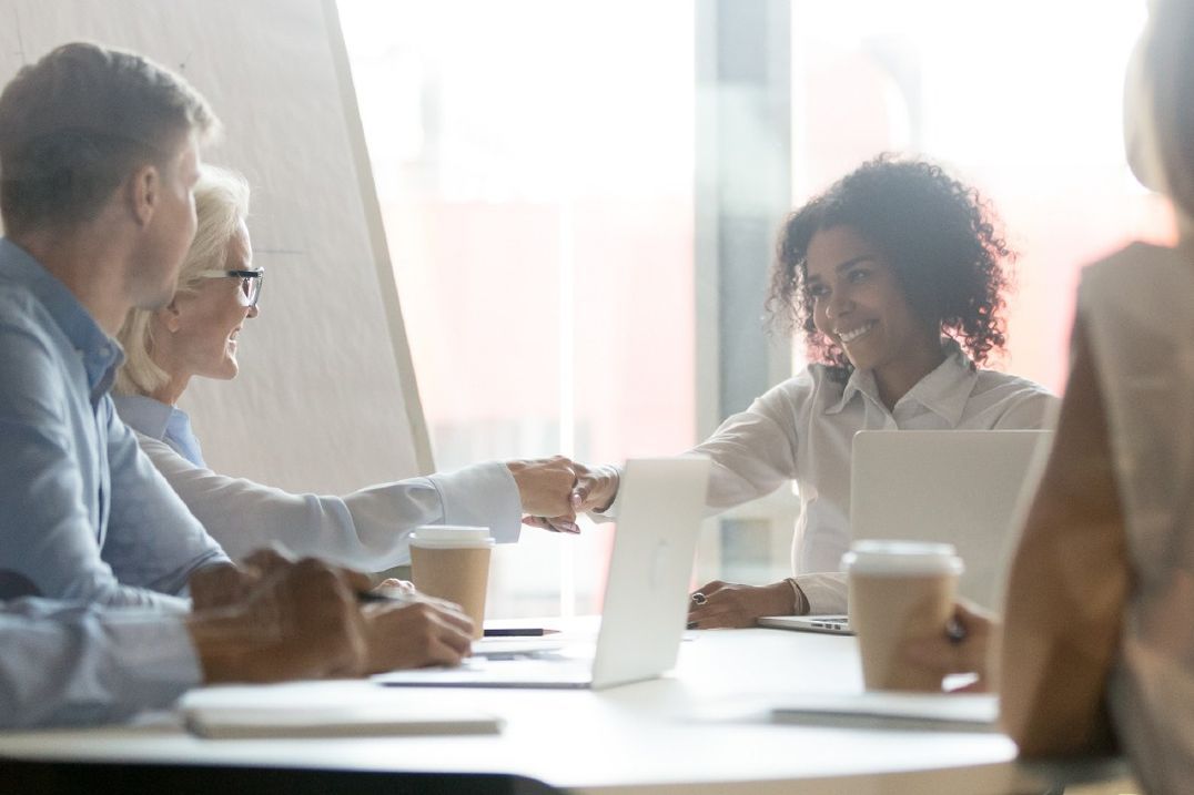 Workers  sitting at a conference table